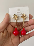 Pendientes largos de flor con bola -echo mano PEN699