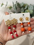 Aretes colgantes vintage con flor dorada y cuentas rojas pen899