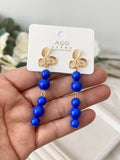 Pendiente Aretes colgantes vintage con flor dorada y cuentas rojas pen699