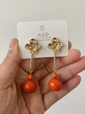 Pendientes largos de flor con bola -echo mano PEN699